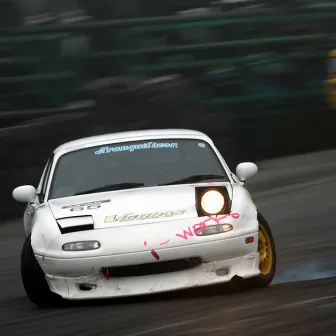 Miata drifts by Elk