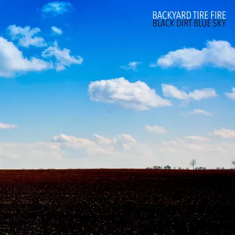 Black Dirt Blue Sky by Backyard Tire Fire