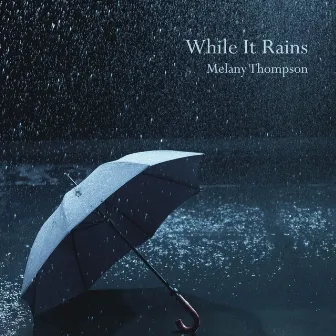 While It Rains by Melany Thompson