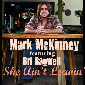 She Ain't Leavin (Radio Version) [feat. Bri Bagwell] by Mark McKinney