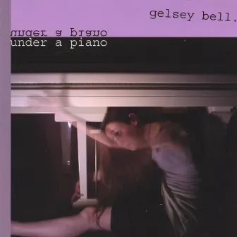 under a piano by Gelsey Bell