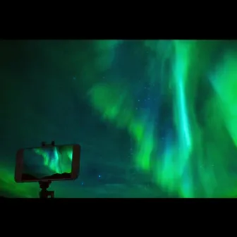 watching the northern lights on my phone by Argo Nuff