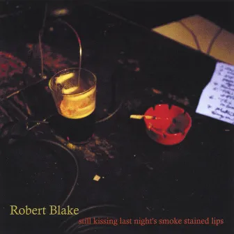 Still Kissing Last Night's Smoke Stained Lips by Robert Blake