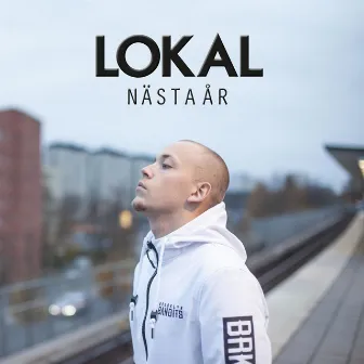 Nästa år by Lokal